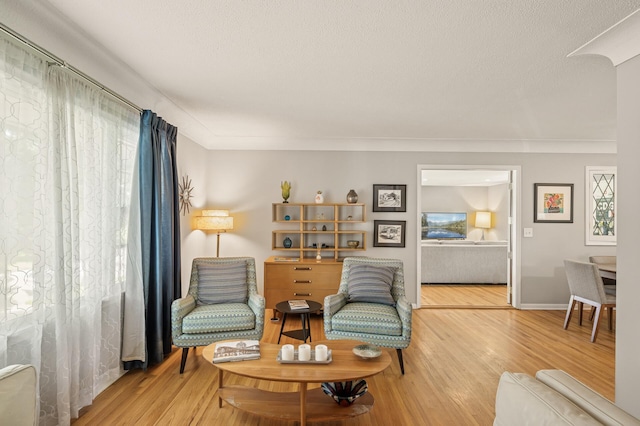 3420 Parkview Blvd, Robbinsdale, MN 55422 - sitting room with wood finished floors and a textured ceiling