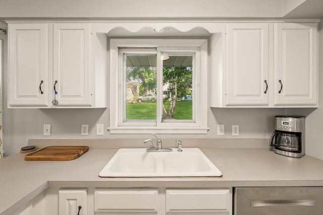3420 Parkview Blvd, Robbinsdale, MN 55422 - kitchen with light countertops, white cabinets, and dishwasher