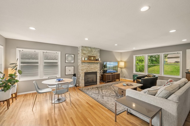 3420 Parkview Blvd, Robbinsdale, MN 55422 - living area featuring a fireplace, wood finished floors, and recessed lighting