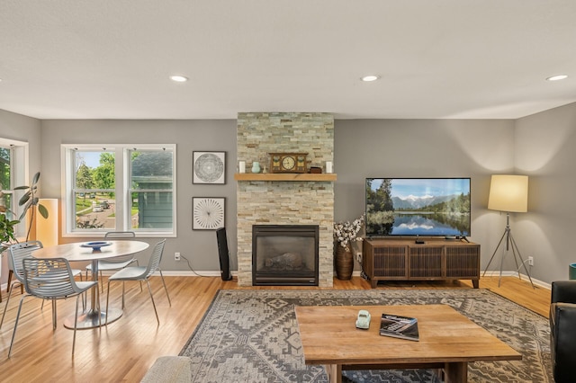 3420 Parkview Blvd, Robbinsdale, MN 55422 - living room featuring wood finished floors, a fireplace, and recessed lighting