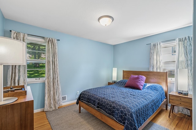 3420 Parkview Blvd, Robbinsdale, MN 55422 - bedroom with light wood-style flooring and baseboards
