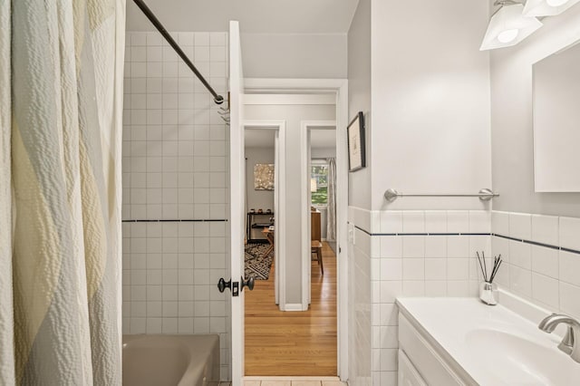 3420 Parkview Blvd, Robbinsdale, MN 55422 - full bath featuring shower / bath combination with curtain, vanity, tile walls, and wood finished floors