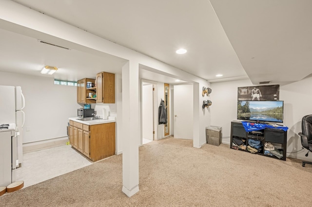3420 Parkview Blvd, Robbinsdale, MN 55422 - finished basement with light carpet, recessed lighting, and freestanding refrigerator