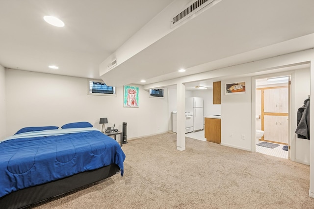 3420 Parkview Blvd, Robbinsdale, MN 55422 - bedroom featuring freestanding refrigerator, light carpet, recessed lighting, and connected bathroom