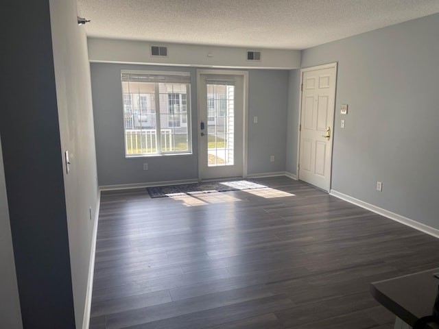 2012 11th Ave SE Unit B, Rochester, MN 55904 - unfurnished room with a textured ceiling and dark wood finished floors