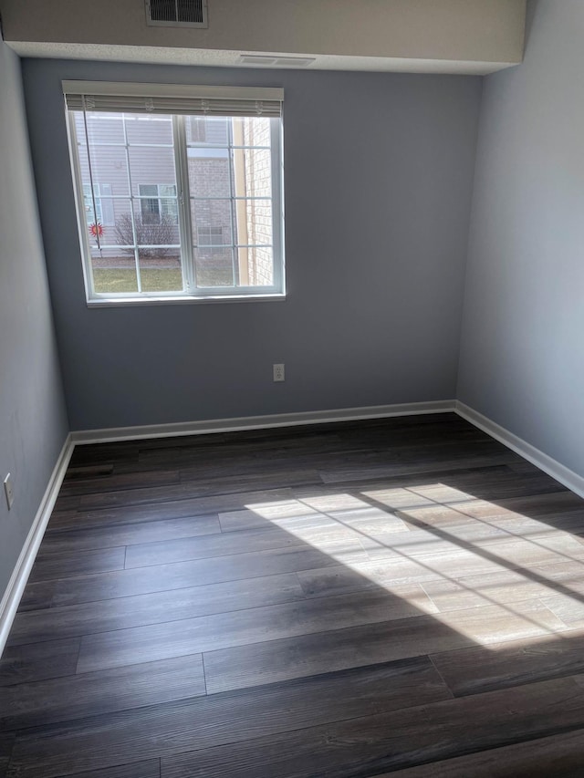 2012 11th Ave SE Unit B, Rochester, MN 55904 - spare room with dark wood finished floors and baseboards