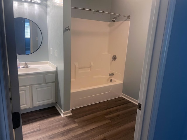 2012 11th Ave SE Unit B, Rochester, MN 55904 - bathroom featuring bathtub / shower combination, vanity, and wood finished floors