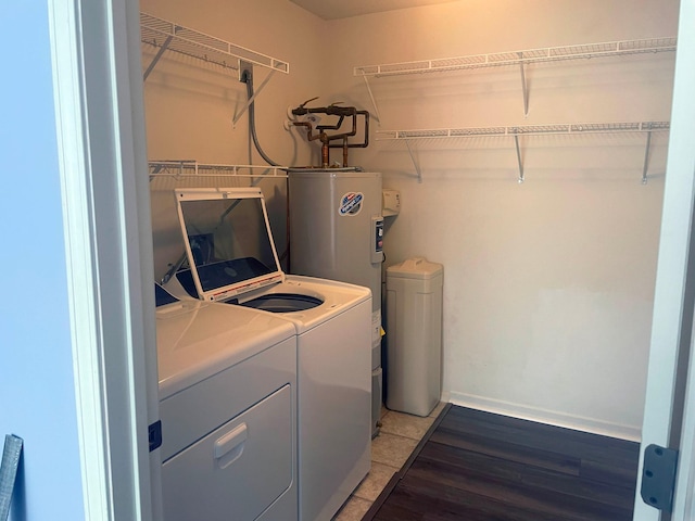 2012 11th Ave SE Unit B, Rochester, MN 55904 - laundry area with washing machine and clothes dryer, water heater, and light wood-style flooring