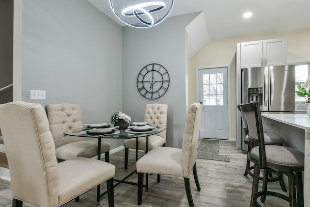 4220 Brookside Ave, Saint Louis Park, MN 55416 - dining area with a chandelier, light wood-style floors, lofted ceiling, and recessed lighting