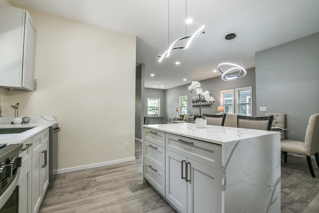 4220 Brookside Ave, Saint Louis Park, MN 55416 - kitchen with open floor plan, range, light wood finished floors, recessed lighting, and light stone countertops