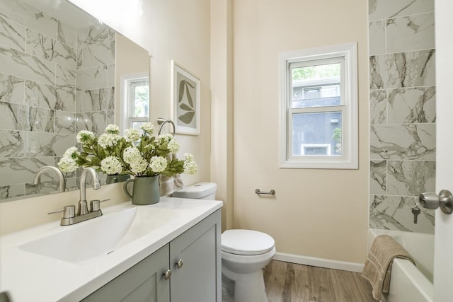 4220 Brookside Ave, Saint Louis Park, MN 55416 - bathroom with vanity, wood finished floors, and bathtub / shower combination