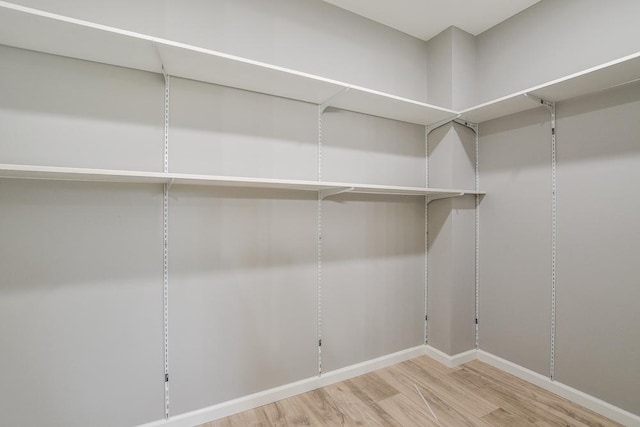 4220 Brookside Ave, Saint Louis Park, MN 55416 - walk in closet featuring wood finished floors