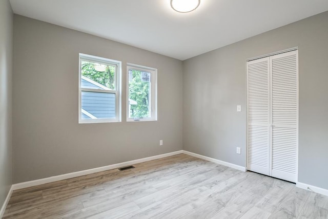 4220 Brookside Ave, Saint Louis Park, MN 55416 - unfurnished bedroom with a closet and light wood-type flooring