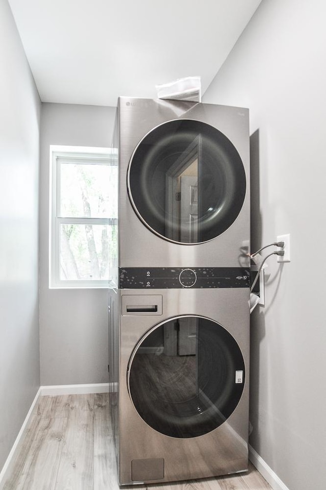 4220 Brookside Ave, Saint Louis Park, MN 55416 - laundry area featuring stacked washer / drying machine and wood finished floors