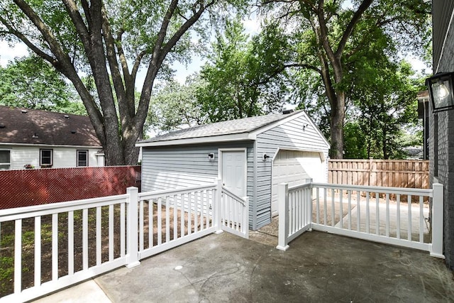 4220 Brookside Ave, Saint Louis Park, MN 55416 - view of patio featuring a detached garage and an outbuilding