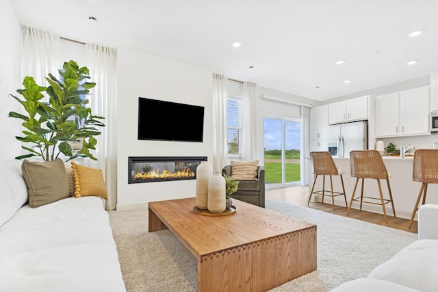 5413 Queens Dr NW, Rochester, MN 55901 - living room featuring recessed lighting and a glass covered fireplace