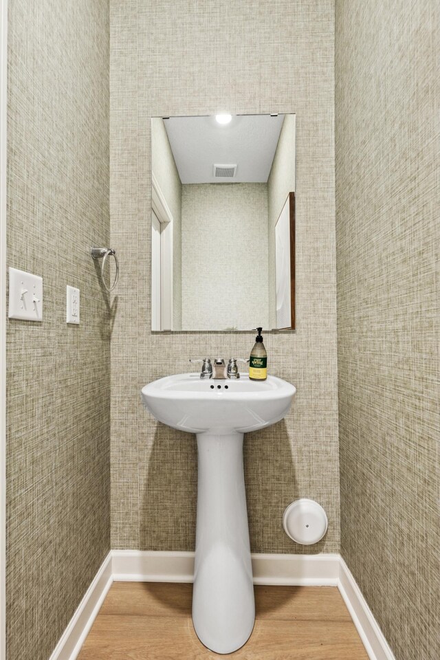 5413 Queens Dr NW, Rochester, MN 55901 - bathroom with wood finished floors and tile walls