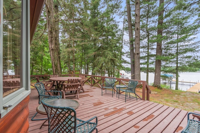25761 Echo Bay Rd, Bay Lake Twp, MN 56444 - wooden deck featuring a water view and outdoor dining area
