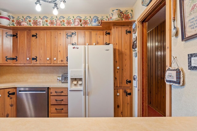 25761 Echo Bay Rd, Bay Lake Twp, MN 56444 - kitchen with white fridge with ice dispenser, dishwasher, light countertops, and brown cabinetry