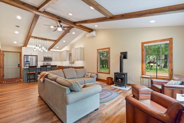 25761 Echo Bay Rd, Bay Lake Twp, MN 56444 - living area with recessed lighting, an AC wall unit, a wood stove, light wood-type flooring, and a ceiling fan