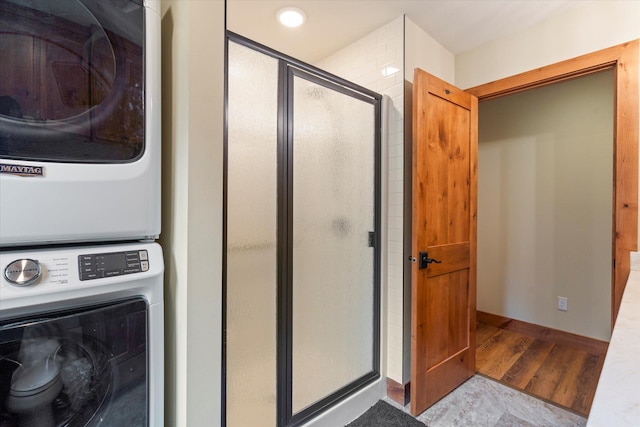 25761 Echo Bay Rd, Bay Lake Twp, MN 56444 - washroom with estacked washer and dryer and wood finished floors