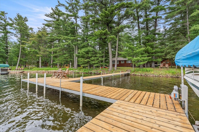 25761 Echo Bay Rd, Bay Lake Twp, MN 56444 - dock with a water view and view of wooded area