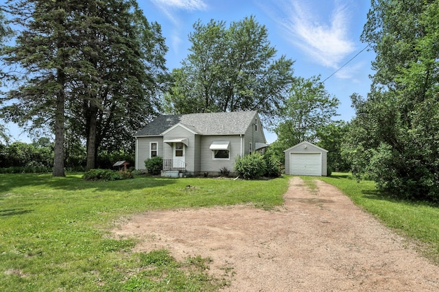 8775 County Road 10 E, Waconia, MN 55387 - bungalow-style home featuring an outbuilding, dirt driveway, a front yard, a detached garage, and roof with shingles