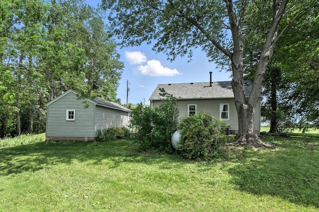 8775 County Road 10 E, Waconia, MN 55387 - view of grassy yard featuring an outbuilding