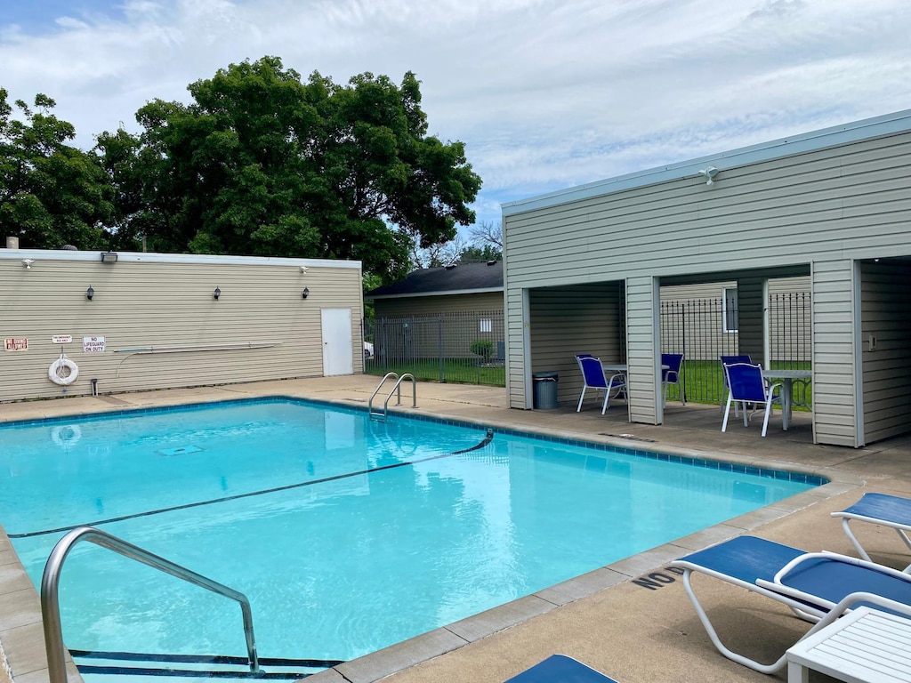 6333 Vera Cruz Ln N, Brooklyn Park, MN 55429 - community pool featuring a patio area