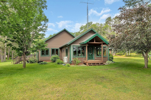 38071 248th St, Hillman, MN 56338 - rear view of property with log veneer siding, a yard, and a deck