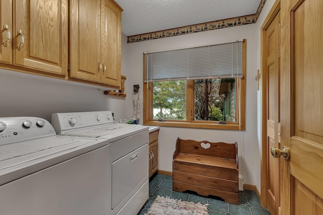 38071 248th St, Hillman, MN 56338 - laundry room featuring washing machine and dryer, cabinet space, and a textured ceiling