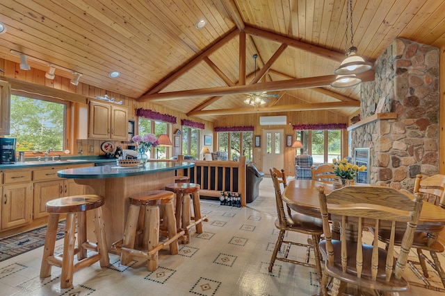 38071 248th St, Hillman, MN 56338 - dining area with a wall unit AC, a wood ceiling with exposed beams, and high vaulted ceiling