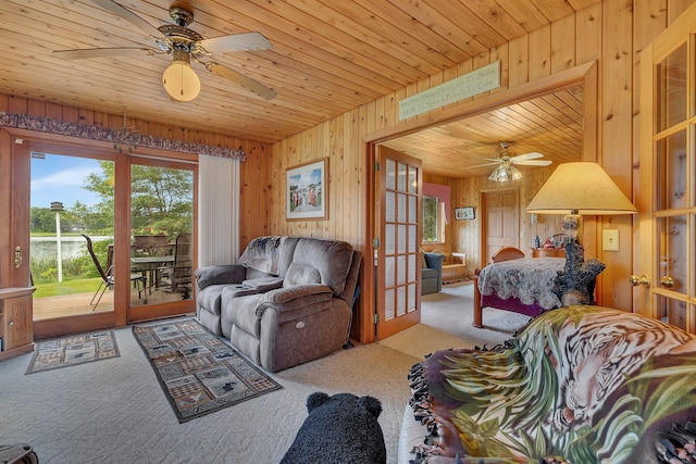 38071 248th St, Hillman, MN 56338 - living area with a ceiling fan, carpet flooring, wooden walls, and wood ceiling