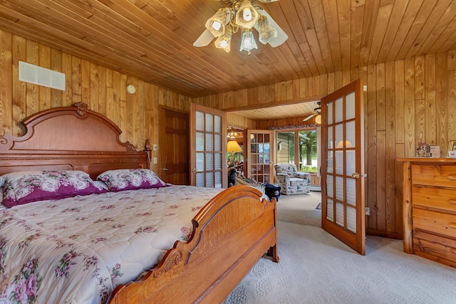 38071 248th St, Hillman, MN 56338 - bedroom with wood walls, carpet flooring, french doors, wooden ceiling, and a ceiling fan