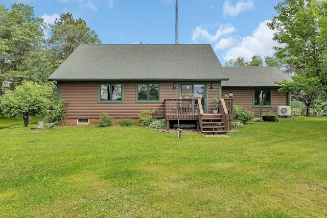 38071 248th St, Hillman, MN 56338 - back of property with a wooden deck, a yard, a shingled roof, and log veneer siding