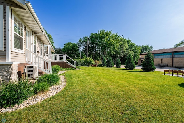 210 1st St, Arthur, ND 58006 - view of green lawn with stairs and a wooden deck