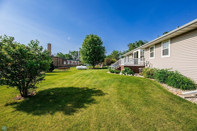 210 1st St, Arthur, ND 58006 - view of grassy yard with a deck
