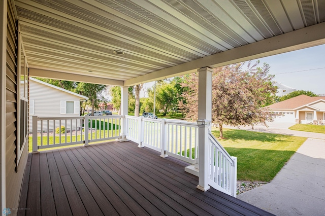 210 1st St, Arthur, ND 58006 - wooden porch featuring a yard