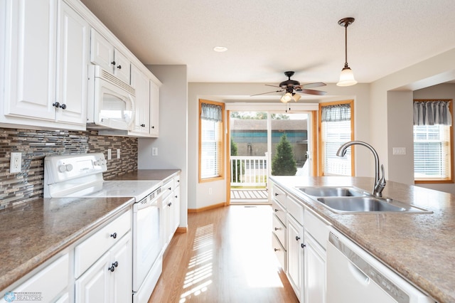 210 1st St, Arthur, ND 58006 - kitchen featuring white appliances, white cabinetry, tasteful backsplash, a ceiling fan, and a textured ceiling