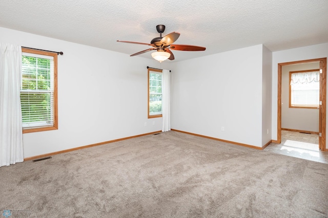 210 1st St, Arthur, ND 58006 - carpeted empty room with a ceiling fan and a textured ceiling