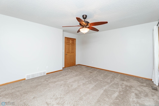 210 1st St, Arthur, ND 58006 - empty room featuring carpet flooring, ceiling fan, and a textured ceiling