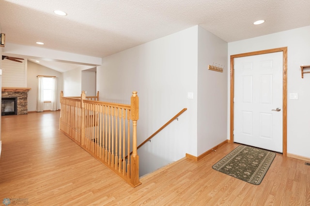 210 1st St, Arthur, ND 58006 - entrance foyer with wood finished floors, lofted ceiling, a textured ceiling, ceiling fan, and recessed lighting