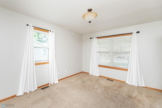 210 1st St, Arthur, ND 58006 - empty room with light colored carpet and baseboards