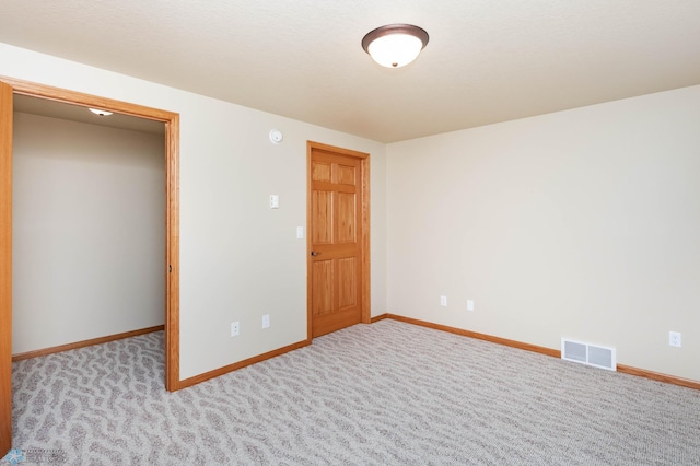 210 1st St, Arthur, ND 58006 - unfurnished bedroom featuring baseboards and carpet floors