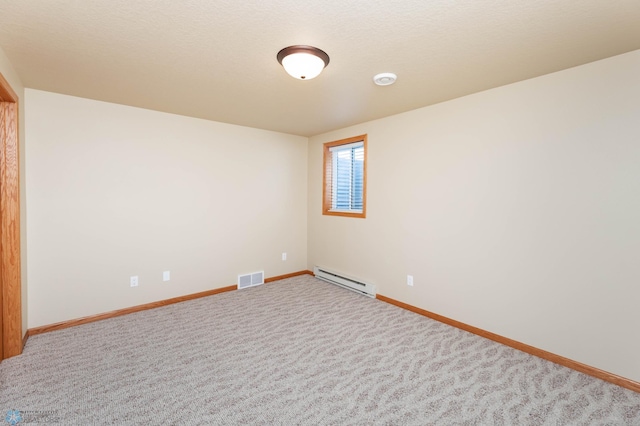 210 1st St, Arthur, ND 58006 - empty room featuring baseboard heating and carpet