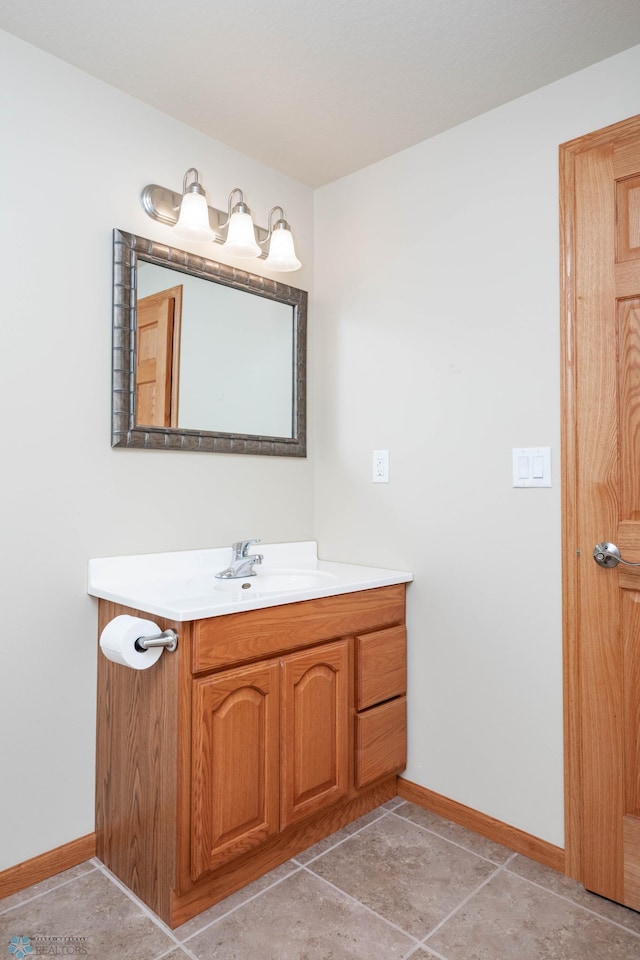 210 1st St, Arthur, ND 58006 - bathroom with baseboards and vanity