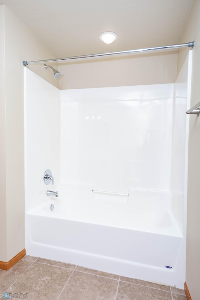 210 1st St, Arthur, ND 58006 - bathroom with shower / bathtub combination and baseboards