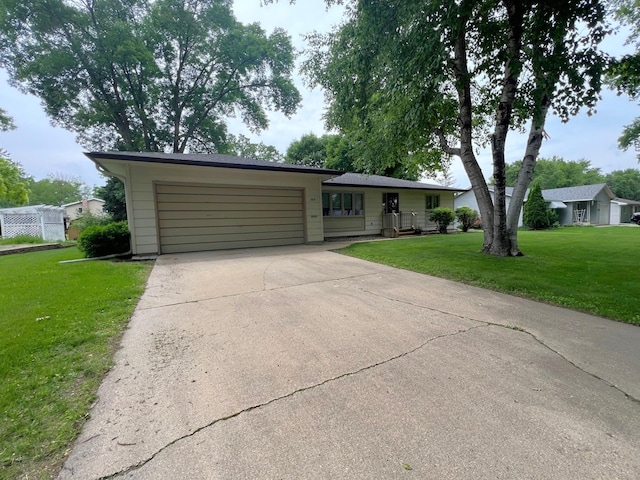1804 7th St SW, Willmar, MN 56201 - ranch-style home featuring a garage, driveway, and a front lawn