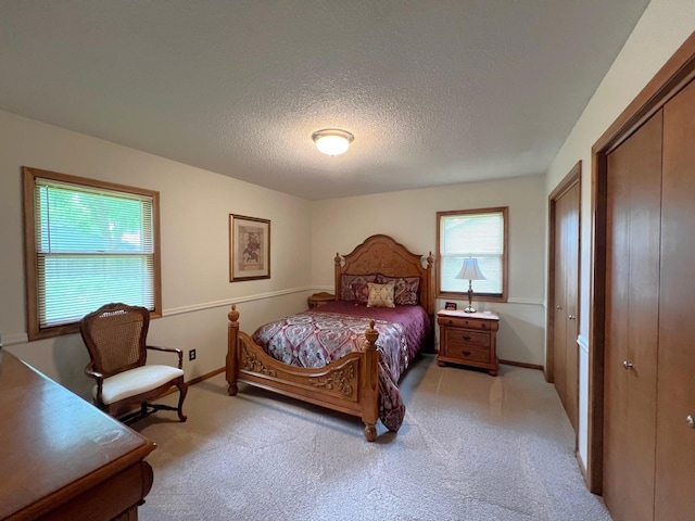 1804 7th St SW, Willmar, MN 56201 - carpeted bedroom featuring a textured ceiling and baseboards