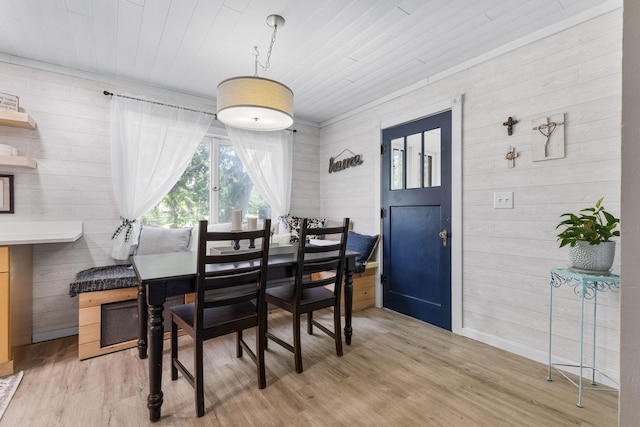 721 1st St N, Waterville, MN 56096 - dining room with light wood-style floors, wooden walls, and wood ceiling